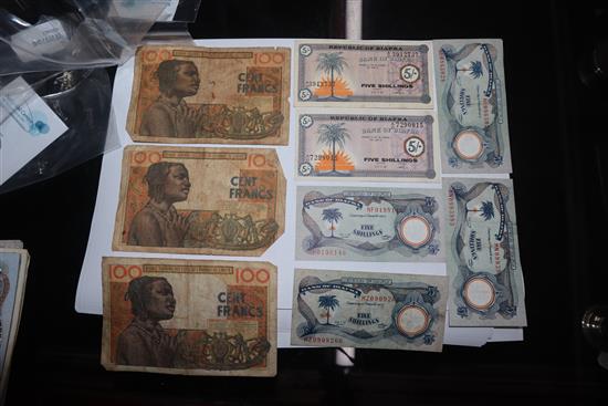 A collection of African and Egyptian currency, including Bank of Biafra banknotes,